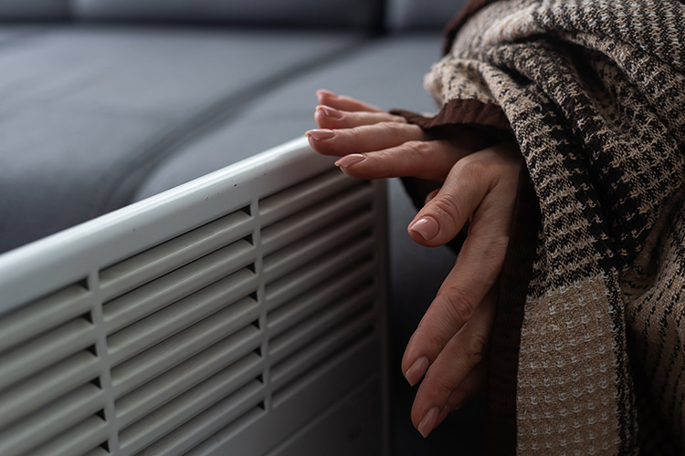 Warming hands by the heater