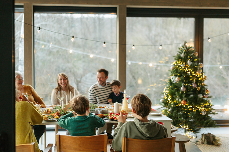 A family gathered at the dinner table during the holidays.